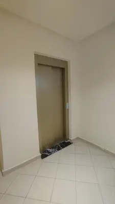 a room with a door in the middle of a wall at Oumnia12 in Fès