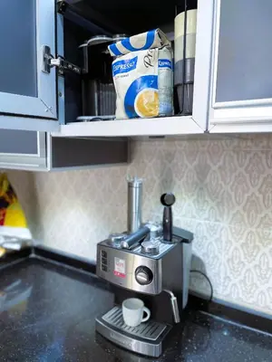 a coffee maker on a counter in a kitchen at شقه معاصره ب لمسة مغربيه في فاس in Fès