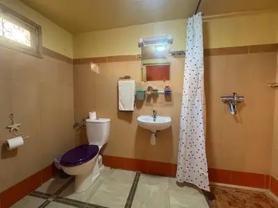 a bathroom with a toilet and a sink at KASBAH ALTAÏR in Kalaat MGouna