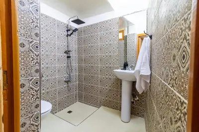 a bathroom with a shower and a sink at Riad Batha in Fès