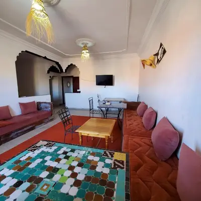 a living room with a couch and a table at WARZAZAT Hostel in Ouarzazate