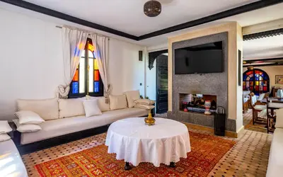 a living room with a couch and a table at Dar Biona in Marrakech
