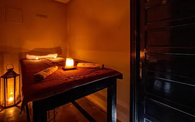a small room with a table with a candle on it at Dar Biona in Marrakech