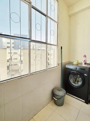 a washing machine in a room with a window at logement exceptionnel réservé aux familles in Meknès