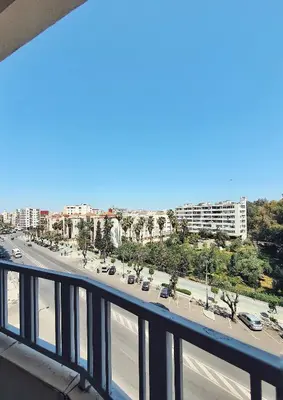 a view from a balcony of a road with cars at logement exceptionnel réservé aux familles in Meknès