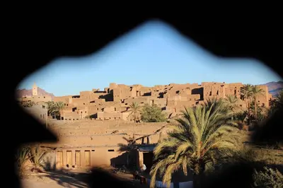 a view of a village from a window at Kasbah Itrane in Tamnougalt