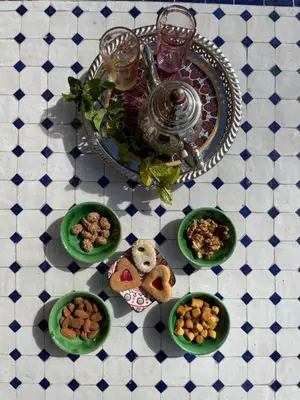 a table topped with plates of food on a table at Dar Mgouna Roses in Kalaat MGouna