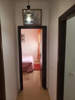 a hallway with a door leading to a bedroom at La belle vue in Ifrane