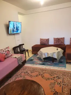 a living room with a bed and a couch at La belle vue in Ifrane