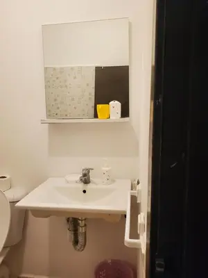 a bathroom with a sink and a mirror at La belle vue in Ifrane