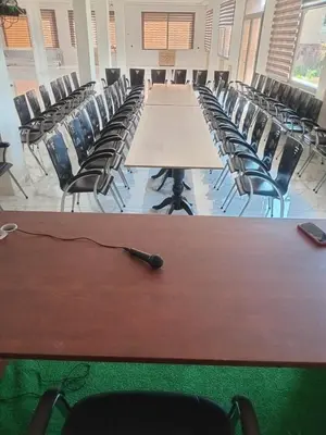 a conference room with a long table and chairs at AUBERGE JOMANA PARK in Azrou