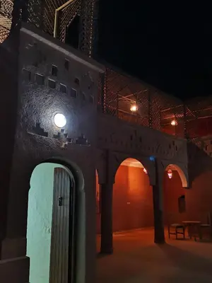a building with a door in the middle of a room at Kasbah Ziwana - Guesthouse in Zagora