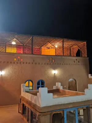 a view of the inside of a building at night at Kasbah Ziwana - Guesthouse in Zagora