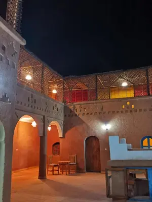 a large room with a table and chairs in it at Kasbah Ziwana - Guesthouse in Zagora