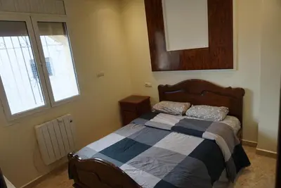 a bedroom with a bed and a window at SamIfrane1 in Zaouia dʼIfrane