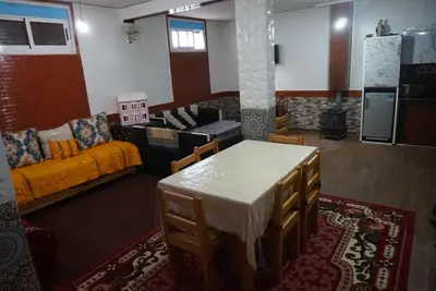 a living room with a table and a couch at SamIfrane1 in Zaouia dʼIfrane