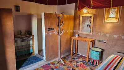 a bathroom with a shower and a sink in a room at Nejma luxury camp erg chegaga in El Gouera