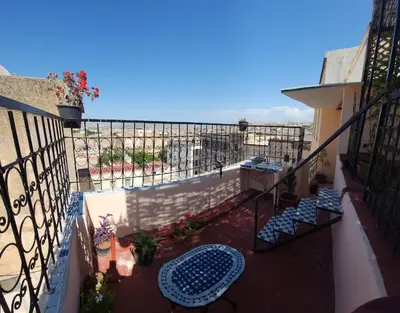 a balcony with a view of the ocean at Dawya terrace in Fès