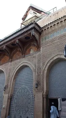 a building with two entrances to a building with a gate at Dawya terrace in Fès