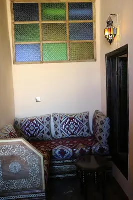 a living room with a couch and a window at Dawya terrace in Fès