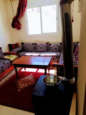 a living room with a couch and a table at Cozzy F2 appartement Ifrane in Ifrane