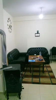 a living room with a couch and a coffee table at Cozzy F2 appartement Ifrane in Ifrane