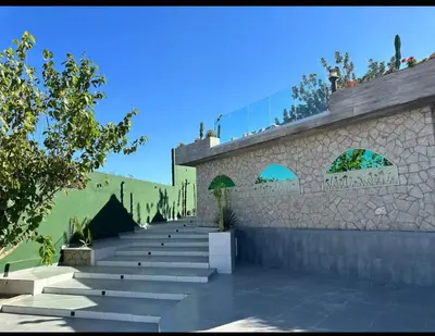 a stone building with stairs and plants on it at Villa SKYVIEW in Beni Mellal