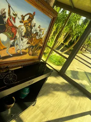 a painting on a shelf in a room with a window at Villa SKYVIEW in Beni Mellal