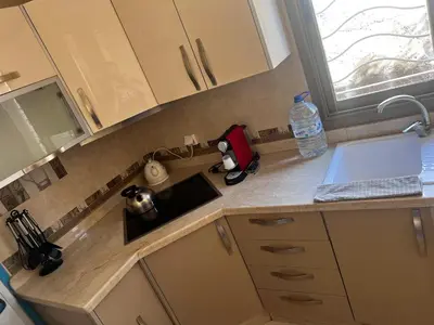 a kitchen counter with a sink and a window at Villa SKYVIEW in Beni Mellal