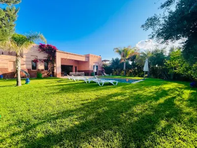 a house with a yard with a swimming pool at Entire villa with private pool in Marrakech in Marrakech
