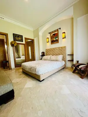 a bedroom with a large bed in a room at Entire villa with private pool in Marrakech in Marrakech