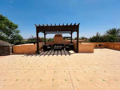 a patio with a gazebo and a table at Entire villa with private pool in Marrakech in Marrakech