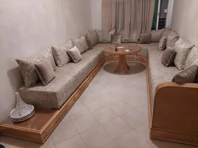 a living room with a couch and a table at Hi Home in Meknès