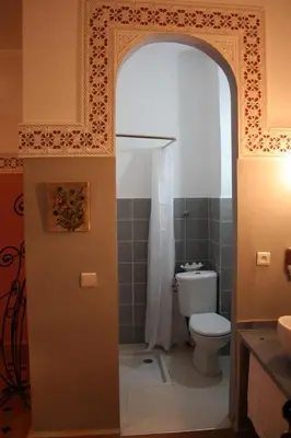 an open door to a bathroom with a toilet at Ryad Meknassia in Meknès
