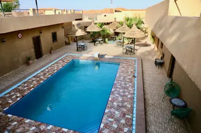 an overhead view of a swimming pool on top of a building at Merzouga Riad Desert Man in Merzouga