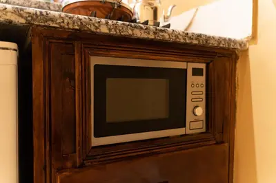 a microwave sitting on top of a counter at La Terrassa appartement climatisé in Azrou