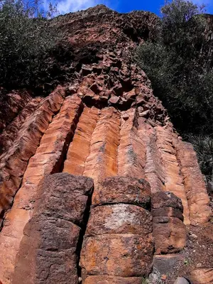 a rocky mountain with trees on the side of it at AYA Farm,Ferme d'hotes Aguelmous in Khenifra