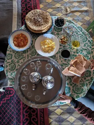 a table with a tray of food on it at Guest House Nomad Life in Merzouga