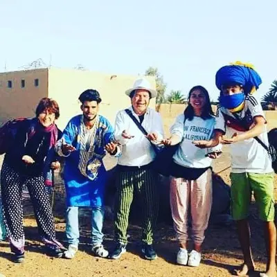 a group of people posing for a picture at Guest House Nomad Life in Merzouga