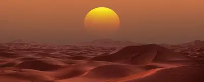 an image of a desert with the sun in the horizon at Idir Luxury Camp in Merzouga
