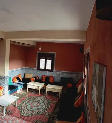 a living room with a couch and a table at Auberge Assays in Taliouine