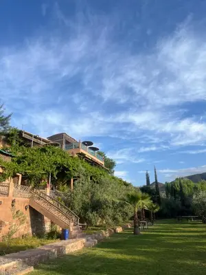 a house on top of a hill with a staircase at Jnane Ayam Atlas in Ourika