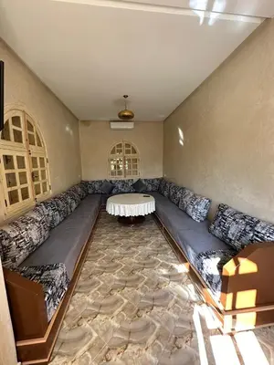 a living room with a couch and a table at Villa Ourika ,Atlas in Ourika