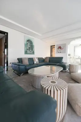 a living room with a couch and a table at DAR KAYIS & LAILA in Marrakech
