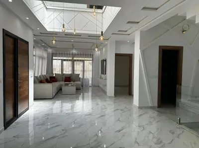 a large living room with a couch and a lobby at Villa Magnolia Meknès Oasis de paix pour famille in Meknès