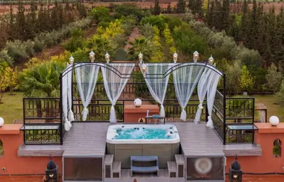 an aerial view of a hot tub on a patio at Villa pension complète Marrakech in Marrakech