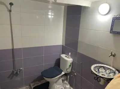 a bathroom with a toilet and a sink at chambres chez Naima Mbarki in Fès