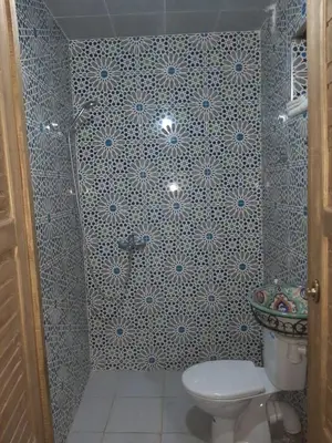 a bathroom with a toilet and a sink at suite 3 people Naima mbarki in Fès