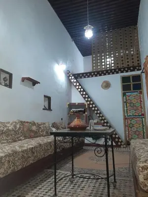 a living room with a couch and a table at suite 3 people Naima mbarki in Fès