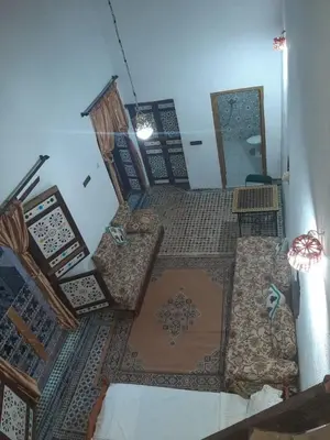 an overhead view of a living room with furniture at suite 3 people Naima mbarki in Fès